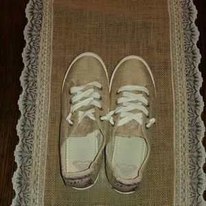 Gold Roxy bayshore slip on shoe.